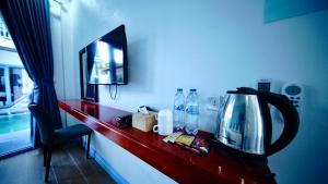 Μια τηλεόραση ή/και κέντρο ψυχαγωγίας στο Luangprabang Sadakham Hotel