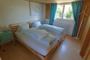 Postel nebo postele na pokoji v ubytování BnB Alpenblick