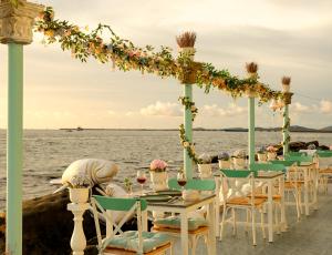 a table set up for a wedding on the beach at Respect Homestay Phu Quoc in Phú Quốc