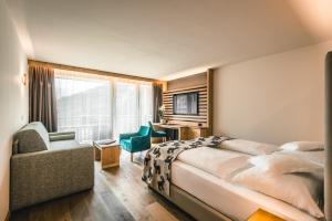 Posteľ alebo postele v izbe v ubytovaní Dolasilla Mountain Panoramic Wellness Hotel