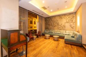 a living room with a couch and a table at Pera Tulip Hotel & Spa in Istanbul