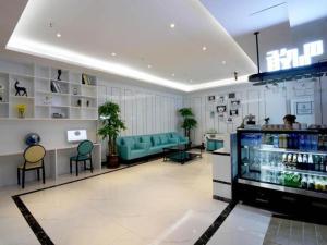 a room with a waiting room with blue chairs and a store at Xana Lite· Xi'an South Gate Yongningmen Subway Station in Xi'an