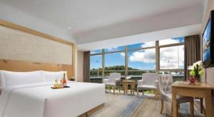 Ένα ή περισσότερα κρεβάτια σε δωμάτιο στο GreenTree Alliance Hotel Shenzhen Futian District Xiangmi Lake Xiangmei Mountain Metro Station