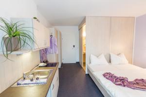 Postel nebo postele na pokoji v ubytování Topmotel