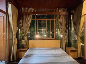 Ένα ή περισσότερα κρεβάτια σε δωμάτιο στο Melalueca homestay