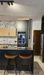 Η κουζίνα ή μικρή κουζίνα στο Motswana