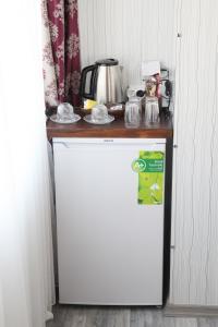 a white refrigerator with a counter on top of it at Kural Butik Pansiyon in Amasra