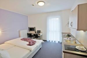 Postel nebo postele na pokoji v ubytování Topmotel