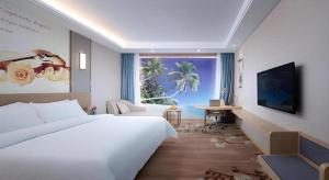 a bedroom with a large white bed and a living room at Vienna Hotel Jinan Railway Station in Jinan