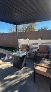 a group of chairs and tables under a canopy at Private Mini Serene Oasis with Pool in Maricopa +40 photos