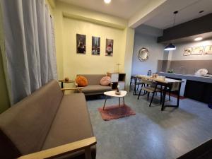 a living room with a couch and a table at The Baluarte in Maasin
