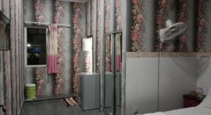 a bedroom with a wall with flowers on it at Unique Hotel in Phnom Penh +48 photos