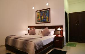 מיטה או מיטות בחדר ב-Hikka Resort