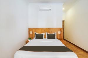 Ένα ή περισσότερα κρεβάτια σε δωμάτιο στο Collection O Bay +28 φωτογραφίες