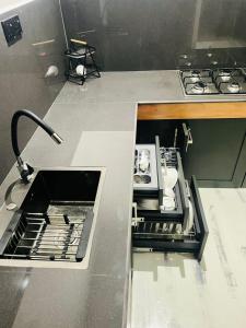 een keuken met een open lade in een aanrecht bij Villa Mangrove Serenity in Galle