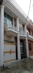 a building with columns and a balcony on it at AL Imran VILLA in Lahore