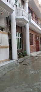 a flooded street in front of a building at AL Imran VILLA in Lahore
