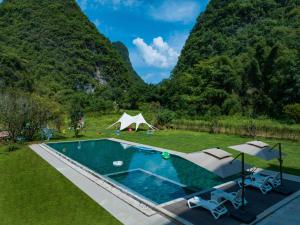 Πισίνα στο ή κοντά στο Xingyun Mujing Hotel