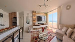 a living room with a view of the ocean at Ocean Blue, Vista Frontal Al Mar in Lima