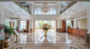 a large lobby with a vase with flowers in it at Kim Bao Hotel in Hải Dương +154 photos