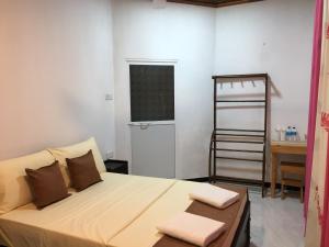 Postel nebo postele na pokoji v ubytování Sheru Guest