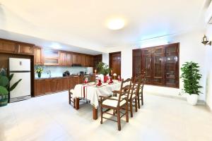 a kitchen with a table and chairs in a room at 500m2 Private Villa 2 min to West Lake 7BR in Hanoi +27 photos