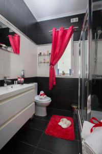 a bathroom with a toilet and a sink and a shower at Marsascala 2 Bedroom Apartment close to Beach! in Marsaskala