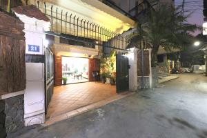 an empty street with a building with a door and a sidewalk at 500m2 Private Villa 2 min to West Lake 7BR in Hanoi