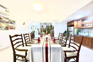 a dining room with a table and chairs at 500m2 Private Villa 2 min to West Lake 7BR in Hanoi