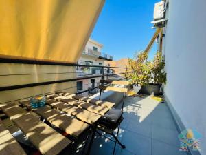 a balcony with a table and chairs on a building at Dimora del Mercante in Catania