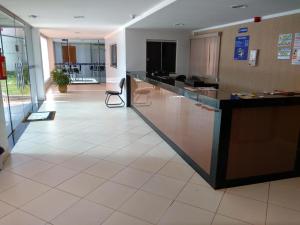 a lobby with a reception desk in a building at Euro Plaza Hotel - Próximo ao Aeroporto de Goiânia, Santa Genoveva in Goiânia