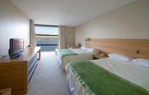 Postel nebo postele na pokoji v ubytování Hotel de Castro
