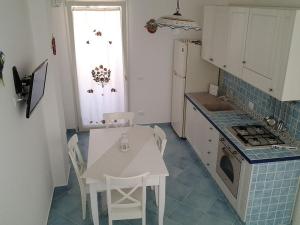 A kitchen or kitchenette at Residenza del Mare & SPA