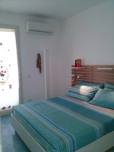 Een bed of bedden in een kamer bij Residenza del Mare & SPA