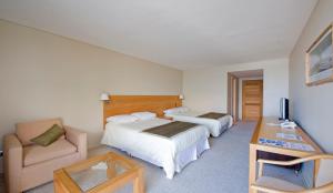 Postel nebo postele na pokoji v ubytování Hotel de Castro