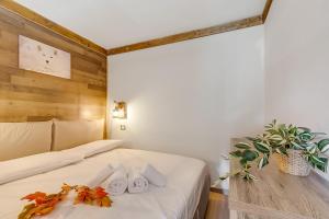 Ένα ή περισσότερα κρεβάτια σε δωμάτιο στο Abeti Ski Apartments