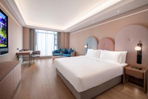Ένα ή περισσότερα κρεβάτια σε δωμάτιο στο Mercure Chengdu Longtan +28 φωτογραφίες