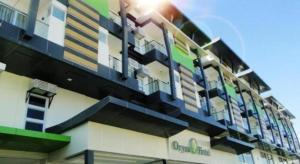 a building with balconies on the side of it at Oryza Hotel in Santiago City