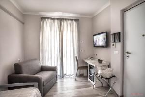 TV a/nebo společenská místnost v ubytování Hotel Villa Giulia