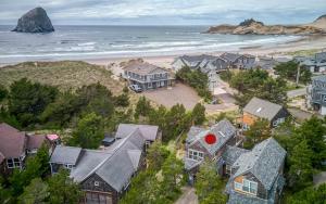 an aerial view of a beach with houses and the ocean at BeachLovers Getaway in Pacific City