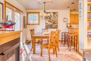 a kitchen and dining room with a wooden table and chairs at BeachLovers Getaway in Pacific City