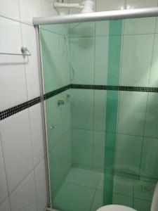a glass shower in a bathroom with a toilet at Euro Plaza Hotel - Próximo ao Aeroporto de Goiânia, Santa Genoveva in Goiânia