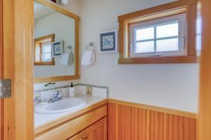 a bathroom with a sink and a mirror at BeachLovers Getaway in Pacific City +45 photos