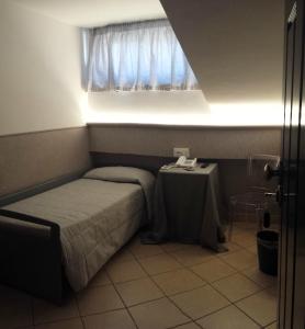 Postel nebo postele na pokoji v ubytování Hotel Villa Giulia