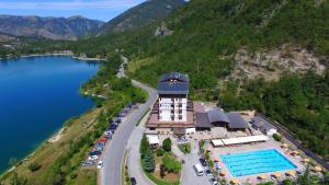 an aerial view of a hotel next to a lake at Park Hotel in Scanno