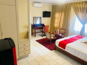 Кровать или кровати в номере D'Villa Guesthouse Airport Junction