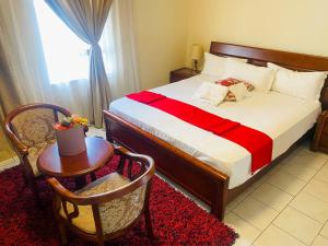 Кровать или кровати в номере D'Villa Guesthouse Airport Junction +6 фотографий