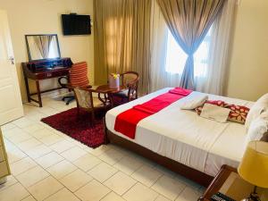 Кровать или кровати в номере D'Villa Guesthouse Airport Junction