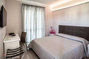 Postel nebo postele na pokoji v ubytování Hotel Villa Giulia