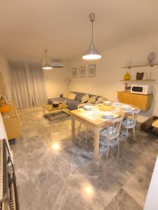 a living room with a table and a couch at Apartamento Los Vencejos in Ruidera